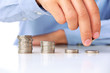 Hand put coin to stack, investment concept