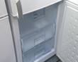 refrigerator cabinet door open. product demonstration in store