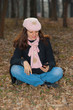 Pretty girl with cellphone outdoors