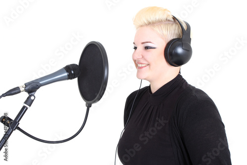 Photo: Happy blonde woman with microphone Happy blonde woman with microphone
