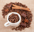 background from coffee of bobs, chocolate, cinnamon and anise on background from coffee of bobs, chocolate, cinnamon and anise on