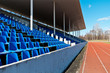tribune of stadium with dark blue seats empty tribune of stadium with dark blue seats empty
