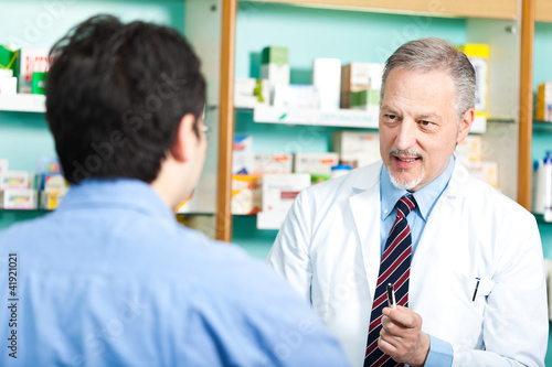 Photo: Pharmacist dealing with a customer Pharmacist dealing with a customer