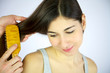 Long hair of female model being brushed