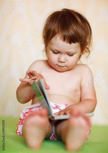 Photo: Happy baby with the book Happy baby with the book