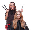 Foto: studio shot of smiley hairdresser with straighteners studio shot of smiley hairdresser with straighteners