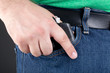 Man pulling gun out of pocket Man pulling gun out of pocket