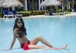 Latin Young Teenager in a Pool