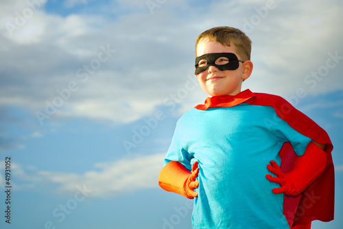 Photo: Child pretending to be a superhero Child pretending to be a superhero