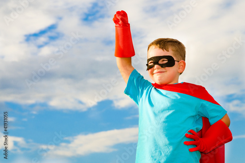 Photo: Child pretending to be a superhero Child pretending to be a superhero