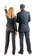 Foto: Back view of pointing business team. Back view of pointing business team.