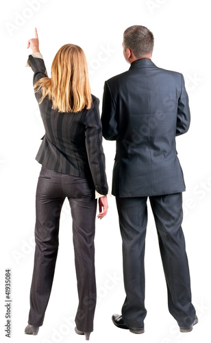 Photo: Back view of pointing business team. Back view of pointing business team.