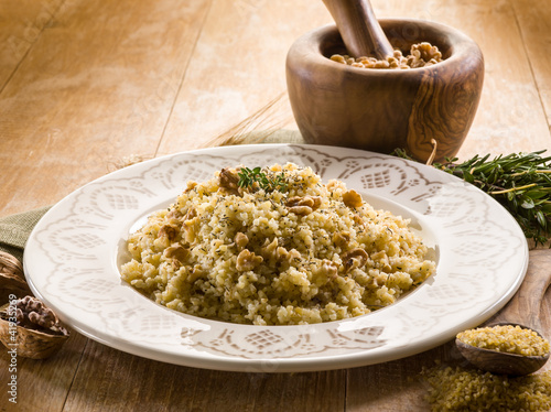 Photo: bulgur with nuts and herbs, vegetarian food bulgur with nuts and herbs, vegetarian food