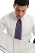 Photo: Investor or Stockbroker reading sharemarket Investor or Stockbroker reading sharemarket