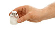 Hand holds salt cellar Hand holds salt cellar