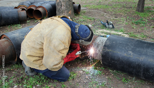 Photo: Welder Welding Two Big Pipes Welder Welding Two Big Pipes