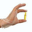 Hand holding ampule with yellow drug Hand holding ampule with yellow drug