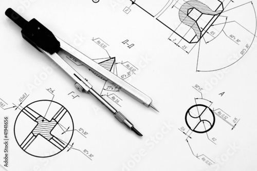 Photo: Compasses and the drawing. Compasses and the drawing.
