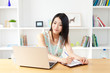 Beautiful young woman using a laptop computer