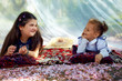 pretty little girls talking and resting in summer canopy