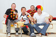 Foto: german soccer fans on the sofa german soccer fans on the sofa