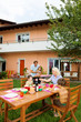 Family having a barbecue in the garden, eating