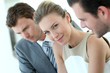Businesswoman attending meeting with colleagues