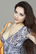 Beautiful fashion woman in sexy dress smiling with modern bag is Beautiful fashion woman in sexy dress smiling with modern bag is