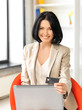 happy woman with laptop computer and credit card happy woman with laptop computer and credit card