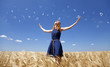 Redhead girl at wheat field in summer day with abstract notes.