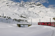 Red train and snow valley