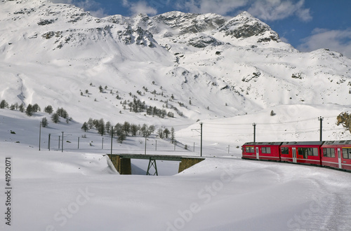Photo: Red train and snow valley Red train and snow valley