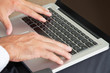 Hands Typing On Keyboard