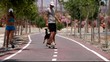 skateboarder man speed and woman running