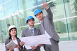 Photo: Business people checking construction site Business people checking construction site