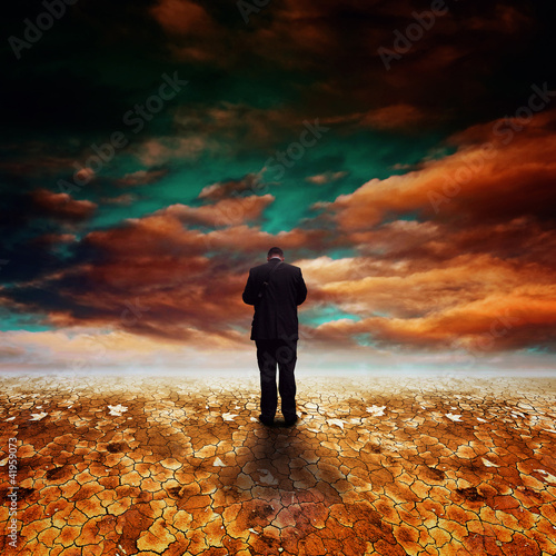 Photo: Businessman in Desert land Businessman in Desert land