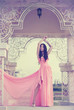 girl in a long pink dress
