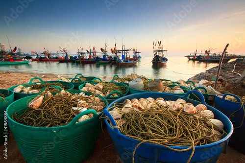 Photo: Fishing nets on the waterfront after fishing day. Fishing nets on the waterfront after fishing day.