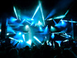 Silhouettes of people in big concert stage