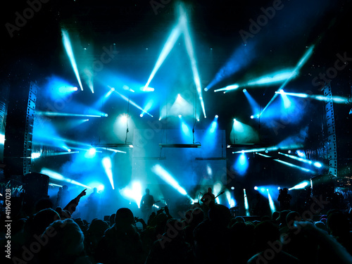 Photo: Silhouettes of people in big concert stage Silhouettes of people in big concert stage