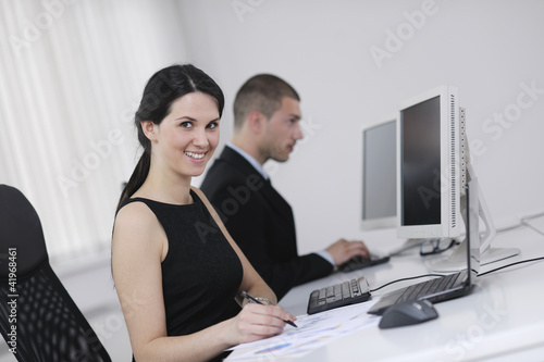 Photo: business people group working in customer and help desk office business people group working in customer and help desk office