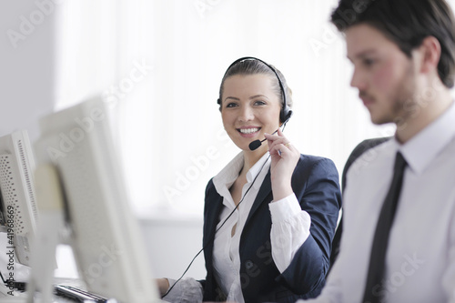 Photo: business people group working in customer and help desk office business people group working in customer and help desk office