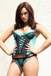 beautiful woman dressed in lingerie standing against an old wall beautiful woman dressed in lingerie standing against an old wall