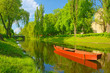 Foto: Spring landscape with boat on the river. Spring landscape with boat on the river.