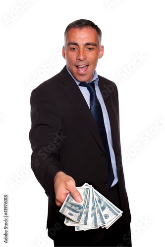 Photo: Excited executive holding and showing cash money Excited executive holding and showing cash money