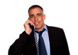Latin charismatic businessman smiling with a phone