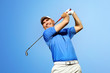 Foto: golfer shooting a golf ball golfer shooting a golf ball