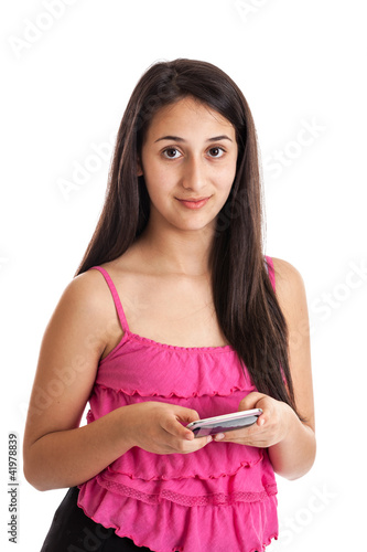 Photo: Teen girl holding smart phone isolated on white Teen girl holding smart phone isolated on white