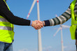 Engineers giving Handshake in a Wind Turbine Power Station Engineers giving Handshake in a Wind Turbine Power Station