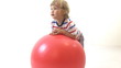 young boy with red ball